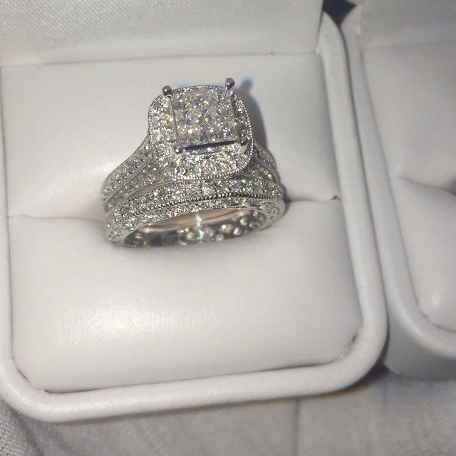 Silver engagement ring with square diamond in a white velvet jewelry box