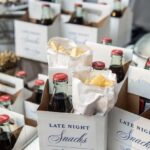 Late night snack boxes with french fries and cola bottles for a wedding