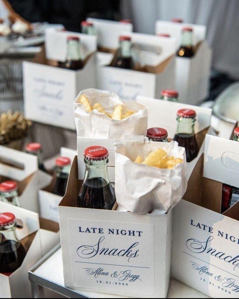 Late night snack boxes with french fries and cola bottles for a wedding